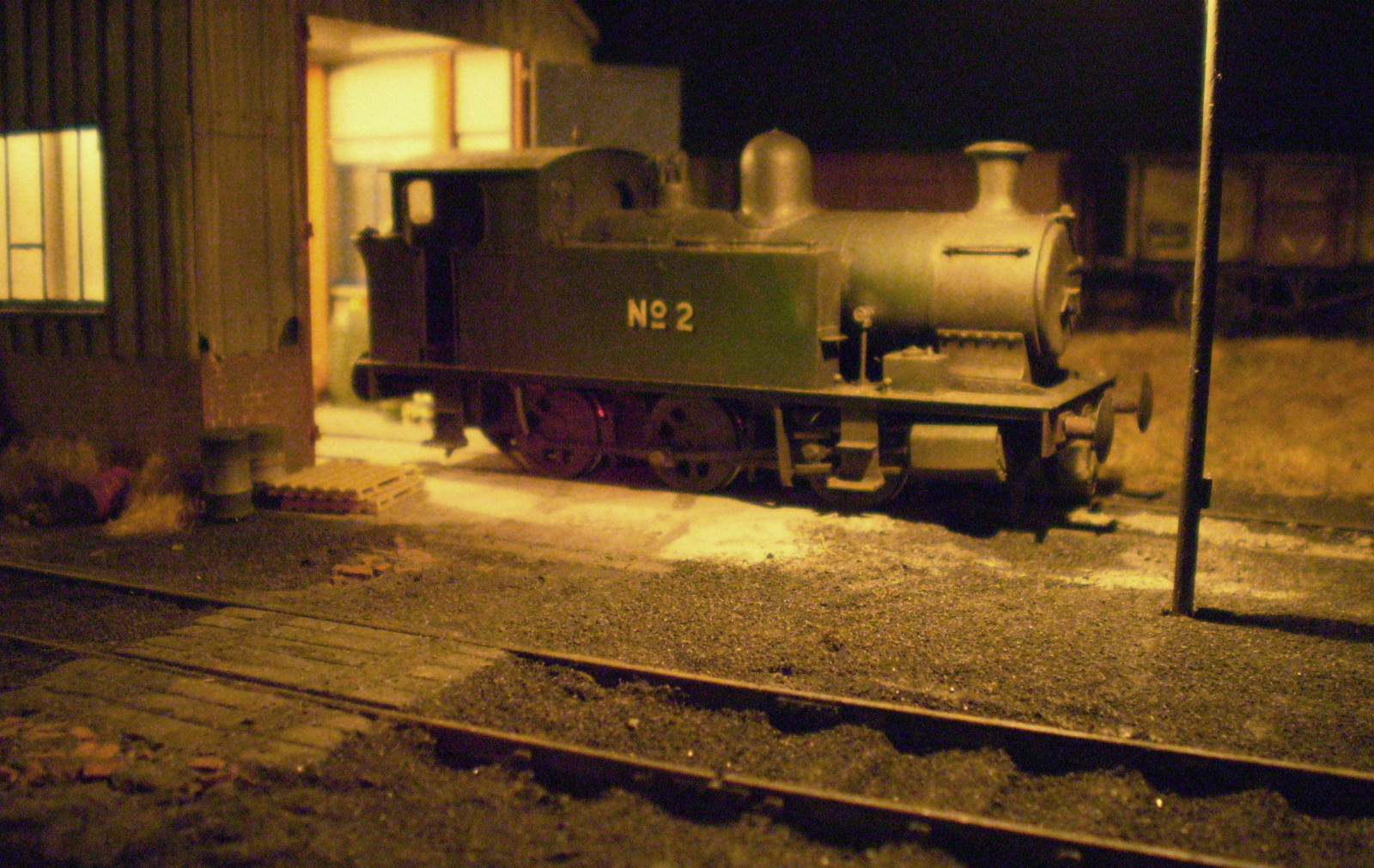 A nighttime scene of a model of No. 2 outside the shed